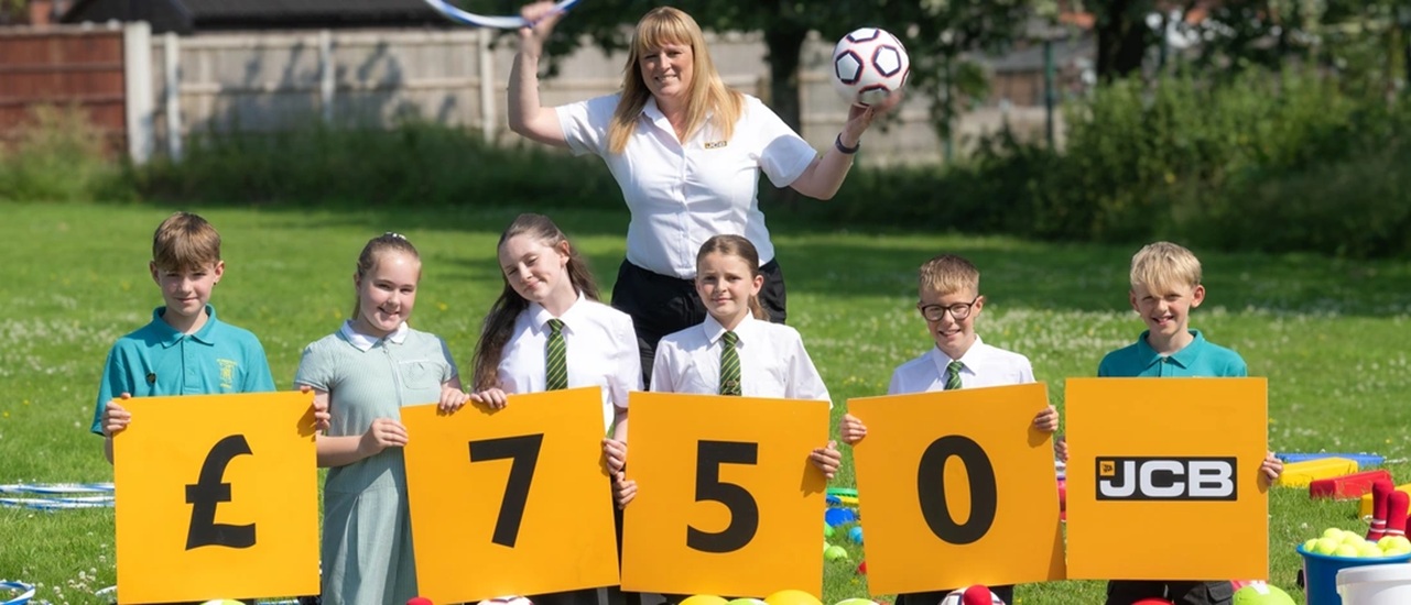 Moorlands school digs new play kit after JCB donation